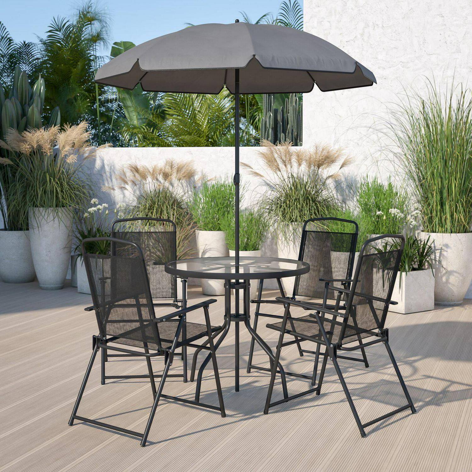 poolside table and chairs with umbrella